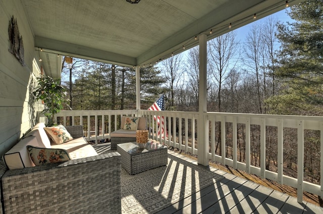 wooden terrace featuring outdoor lounge area