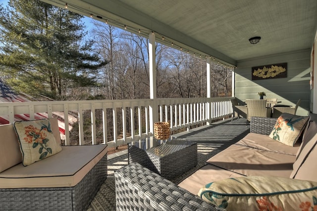 wooden deck featuring an outdoor hangout area