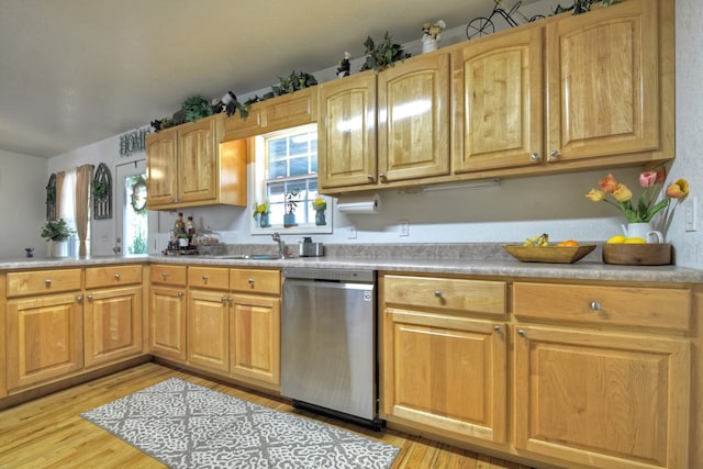 kitchen with dishwasher, sink, light brown cabinets, and light wood-type flooring