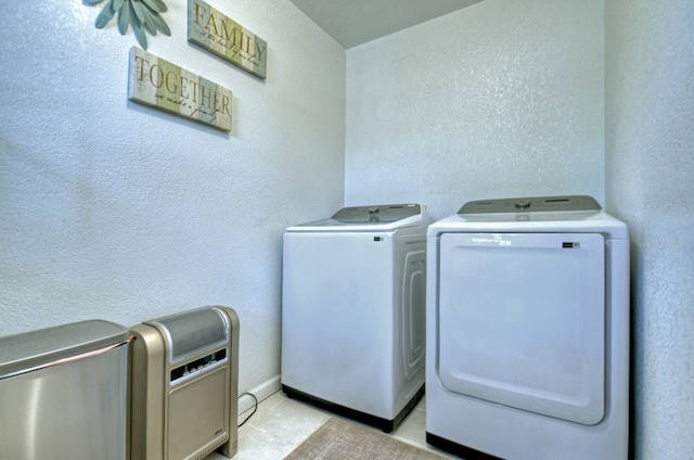 laundry room with light tile patterned floors and independent washer and dryer