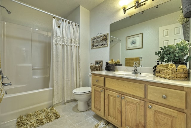 full bathroom with vanity, tile patterned floors, toilet, and shower / bath combo