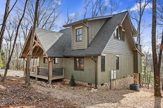 view of front of house with crawl space and a shingled roof