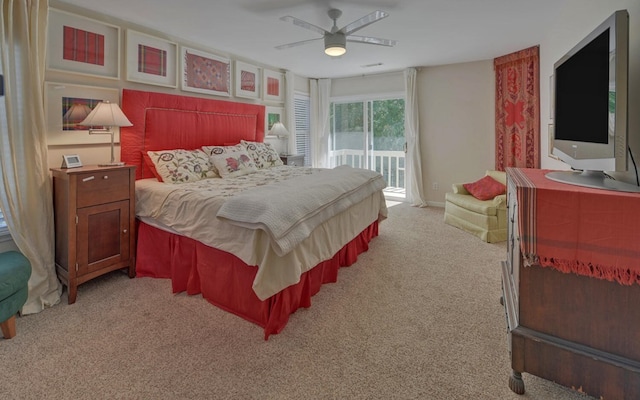 bedroom featuring access to exterior, ceiling fan, and light colored carpet