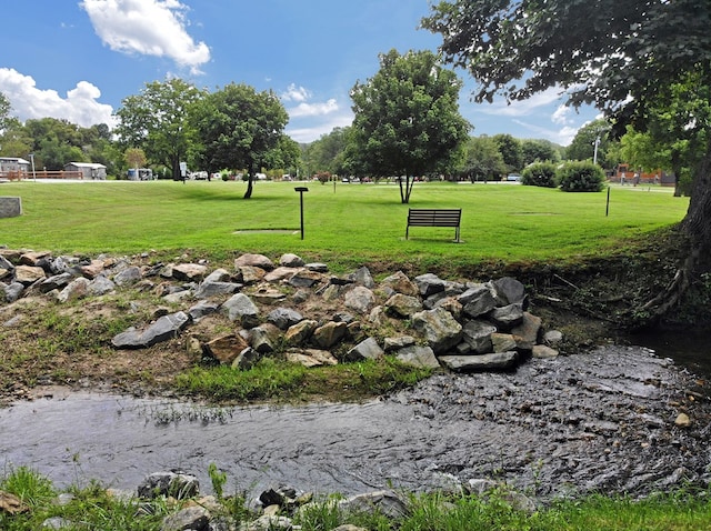 view of home's community featuring a yard