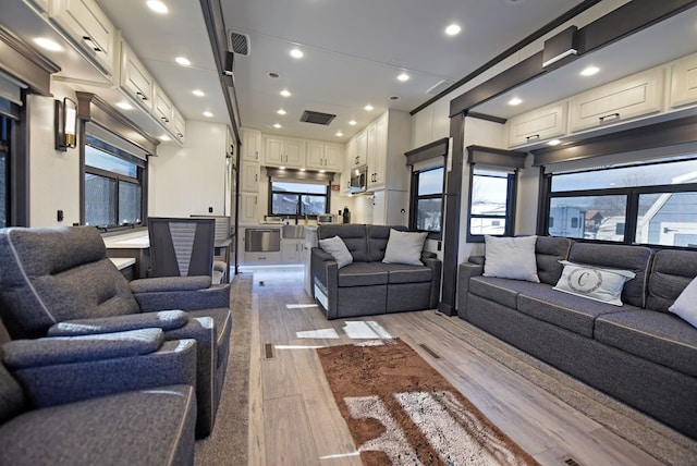 living room with light hardwood / wood-style flooring