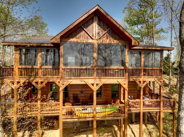 783 Moreland Dr N, Cherry Log, GA 30522 - rear view of house with a deck and a sunroom