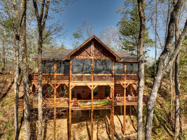 back of house with a wooden deck