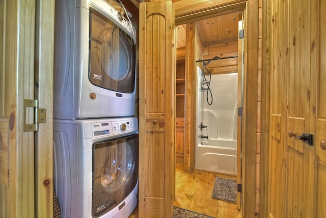 783 Moreland Dr N, Cherry Log, GA 30522 - laundry area featuring wooden ceiling, light hardwood / wood-style flooring, stacked washer and dryer, and wooden walls