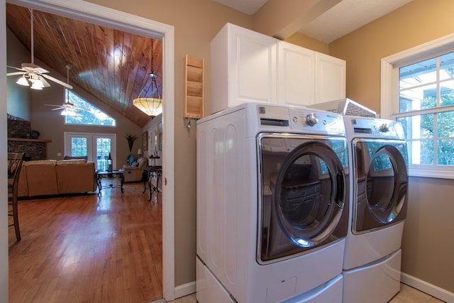 washroom featuring ceiling fan, cabinets, and plenty of natural light