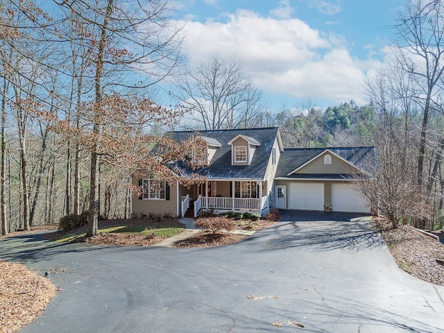 425 Tarheel Dr W, Murphy, NC 28906 - cape cod-style house featuring driveway, an attached garage, and covered porch