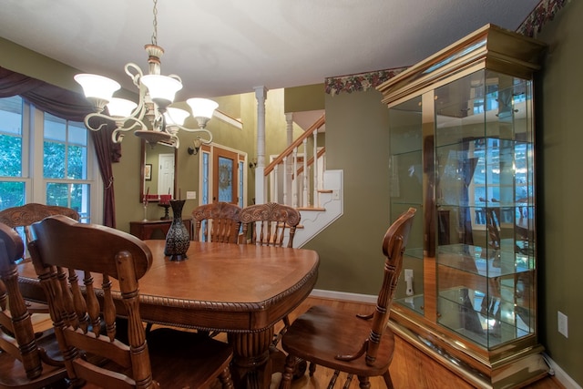 dining area with a chandelier and hardwood / wood-style flooring