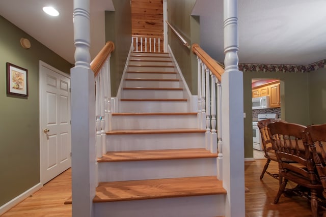 staircase featuring hardwood / wood-style floors