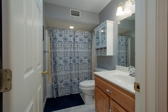 full bathroom featuring toilet, tile patterned floors, vanity, and shower / tub combo with curtain