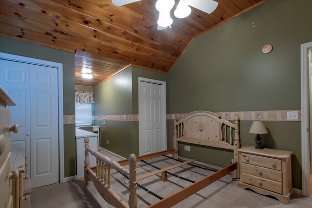 bedroom with ceiling fan, light colored carpet, lofted ceiling, and wood ceiling