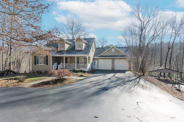 425 Tarheel Dr W, Murphy, NC 28906 - cape cod home featuring a porch, driveway, and an attached garage