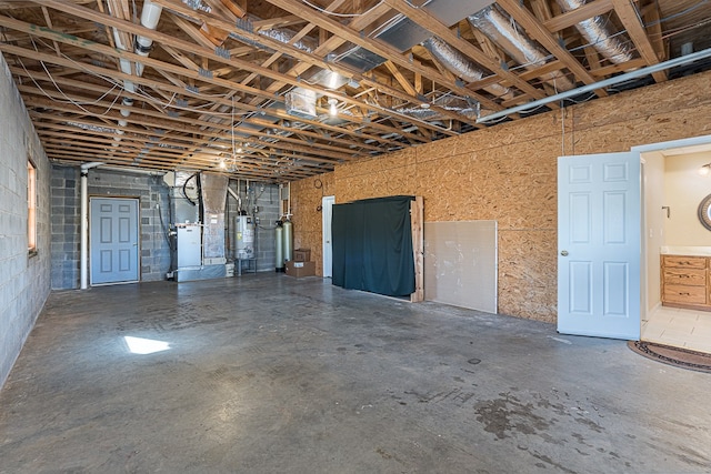 425 Tarheel Dr W, Murphy, NC 28906 - basement featuring gas water heater, heating unit, and concrete block wall