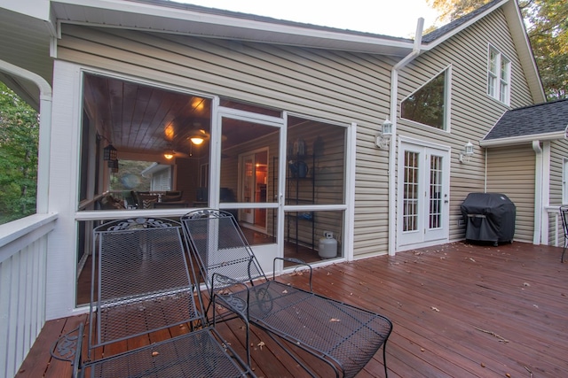 wooden terrace with area for grilling