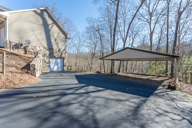 425 Tarheel Dr W, Murphy, NC 28906 - view of property exterior with a carport, stone siding, and aphalt driveway