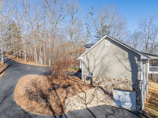 425 Tarheel Dr W, Murphy, NC 28906 - view of home's exterior with a garage and stone siding