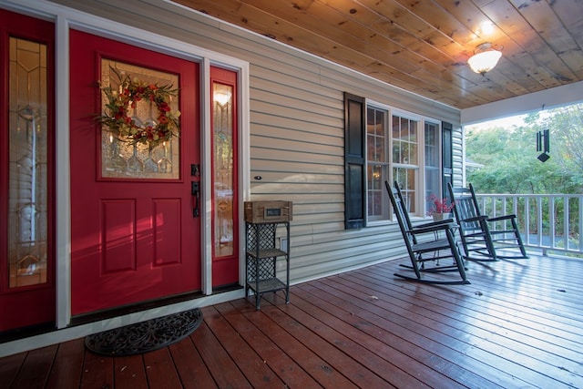 doorway to property featuring covered porch