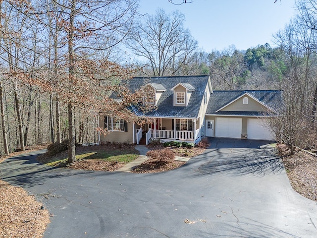425 Tarheel Dr W, Murphy, NC 28906 - cape cod home featuring roof with shingles, an attached garage, covered porch, and aphalt driveway