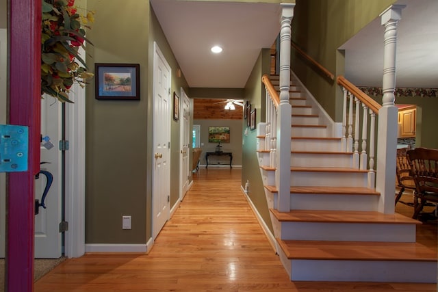 staircase with wood-type flooring