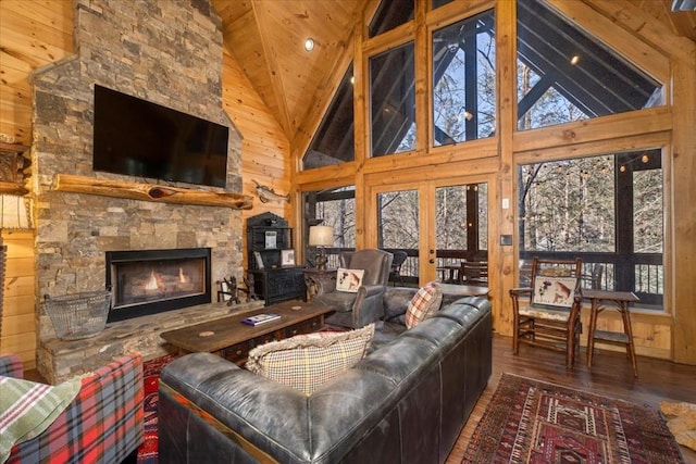510 Gallery Ct, Ellijay, GA 30540 - living room featuring hardwood / wood-style floors, healthy amount of natural light, wooden ceiling, wooden walls, and a stone fireplace