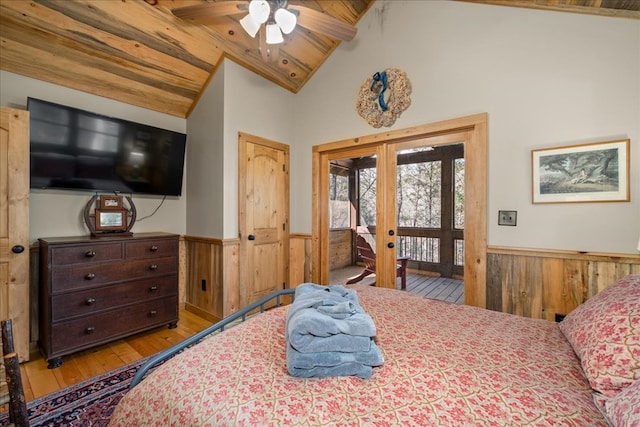 510 Gallery Ct, Ellijay, GA 30540 - bedroom with a wainscoted wall, french doors, wooden walls, access to exterior, and hardwood / wood-style flooring