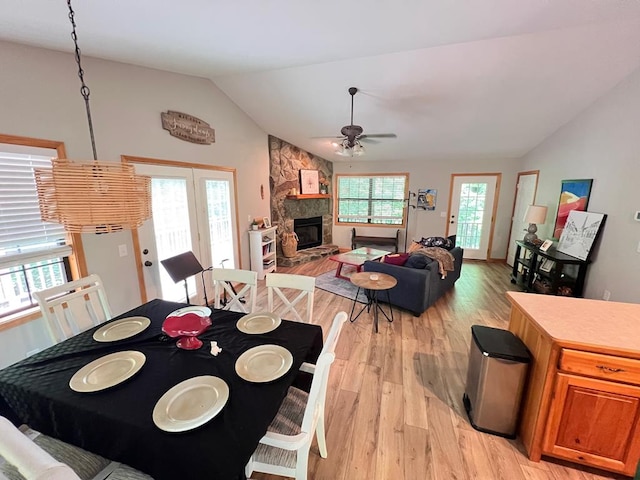 384 Shadow Pines Dr, Murphy, NC 28906 - dining room with vaulted ceiling, light wood-type flooring, ceiling fan, plenty of natural light, and a fireplace