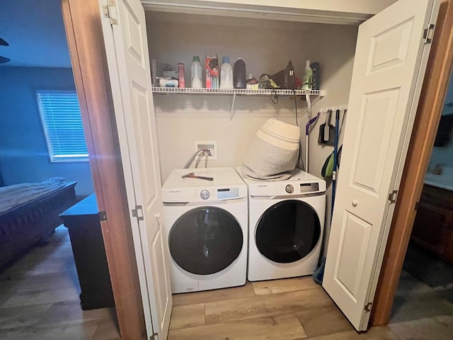 384 Shadow Pines Dr, Murphy, NC 28906 - laundry area featuring washing machine and clothes dryer and wood finished floors