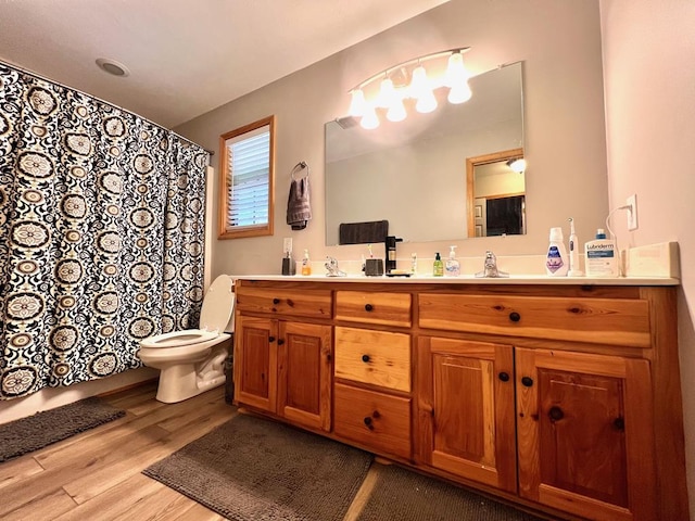 384 Shadow Pines Dr, Murphy, NC 28906 - full bath featuring wood finished floors, double vanity, toilet, and curtained shower