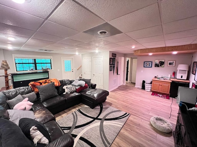 384 Shadow Pines Dr, Murphy, NC 28906 - living room with a paneled ceiling, light wood finished floors, stairs, bar, and baseboards