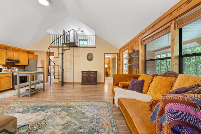 881 Sawyer Cove Rd, Hayesville, NC 28904 - living area featuring stairs, light wood-style flooring, and high vaulted ceiling