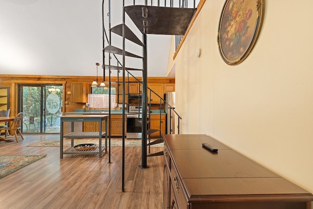 881 Sawyer Cove Rd, Hayesville, NC 28904 - staircase featuring wood finished floors and a towering ceiling