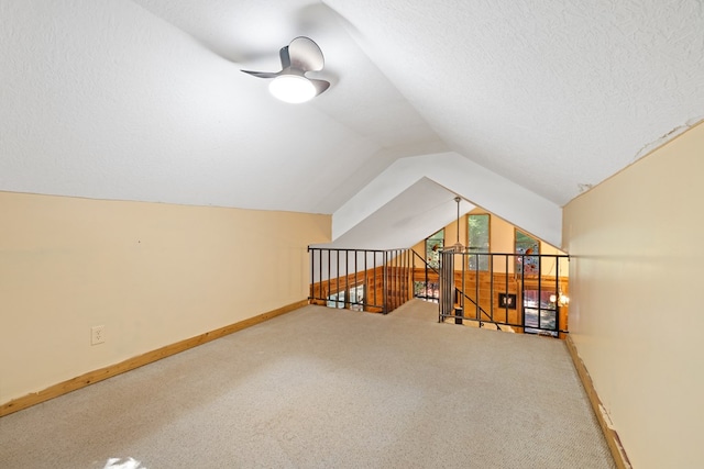 881 Sawyer Cove Rd, Hayesville, NC 28904 - additional living space with vaulted ceiling, ceiling fan, carpet floors, and a textured ceiling