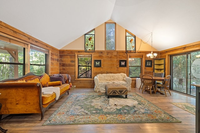 881 Sawyer Cove Rd, Hayesville, NC 28904 - living area with a chandelier, wood finished floors, wooden walls, high vaulted ceiling, and built in shelves