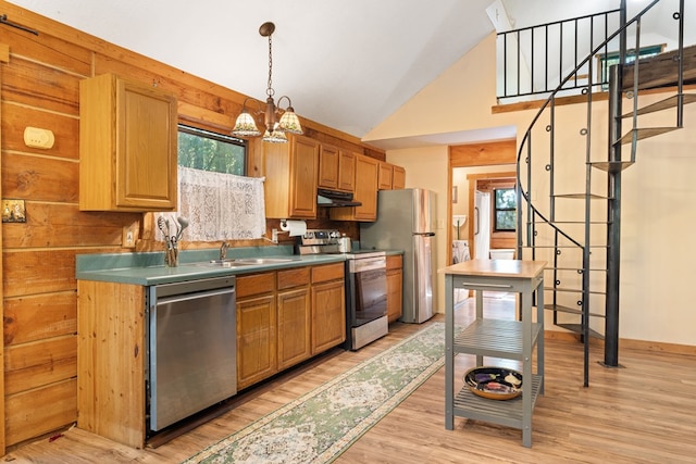 881 Sawyer Cove Rd, Hayesville, NC 28904 - kitchen with stainless steel appliances, under cabinet range hood, light wood-type flooring, a chandelier, and pendant lighting