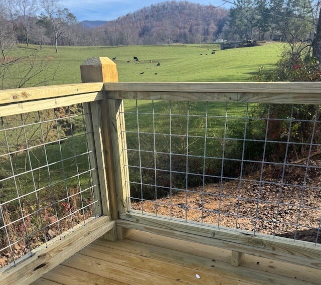 view of gate featuring a mountain view and a rural view