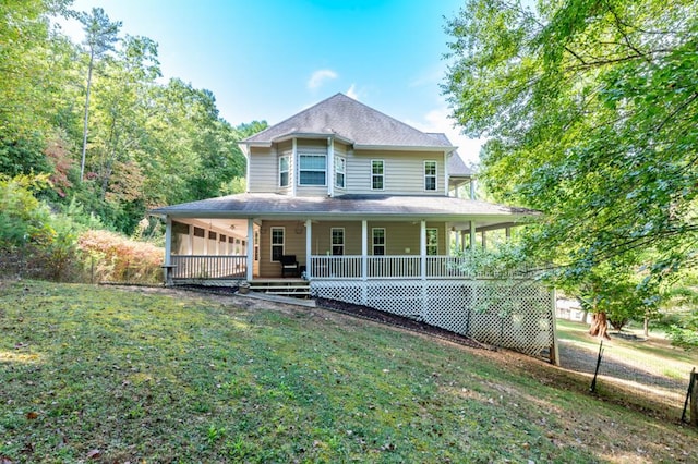 farmhouse inspired home featuring a front lawn and covered porch