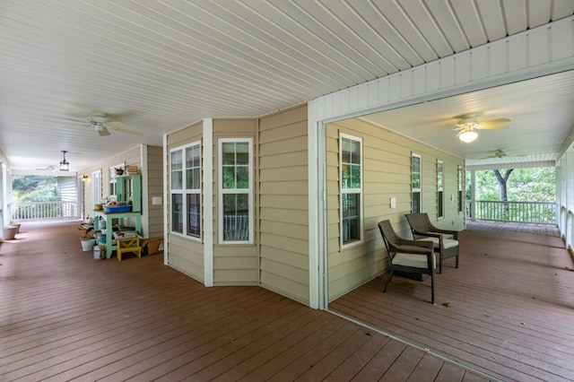 wooden deck featuring ceiling fan