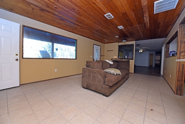 living room with light tile patterned flooring, ceiling fan, and wood ceiling