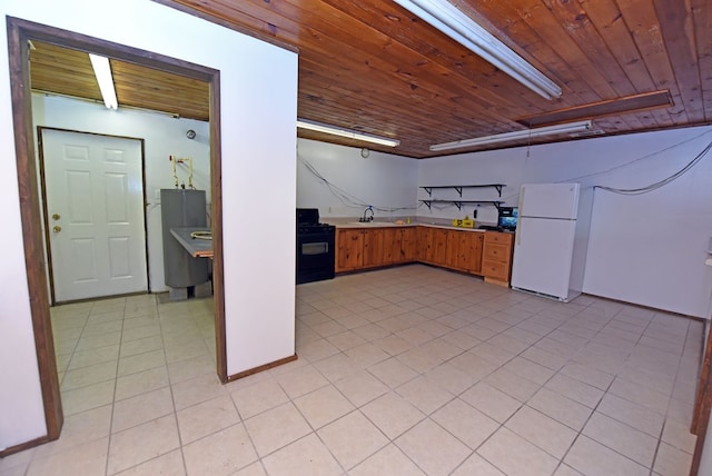 kitchen with light tile patterned flooring, white fridge, wood ceiling, and black range