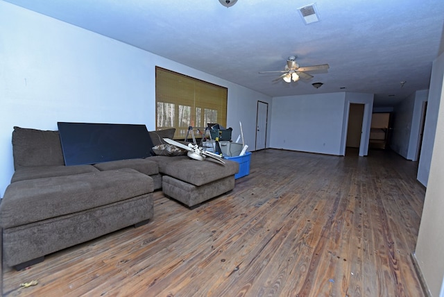 living room featuring hardwood / wood-style flooring and ceiling fan