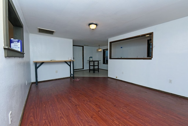 spare room with wood-type flooring