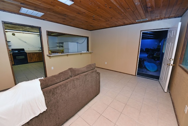 living room with wood ceiling and light tile patterned floors