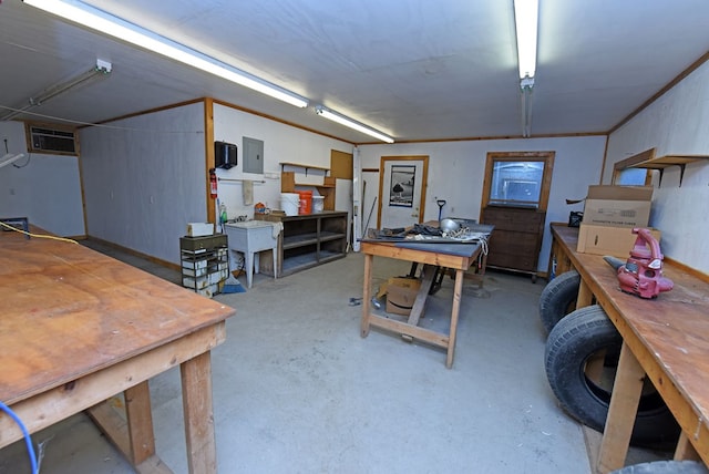 office with a workshop area and electric panel