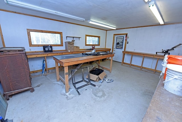 office with a workshop area and concrete flooring