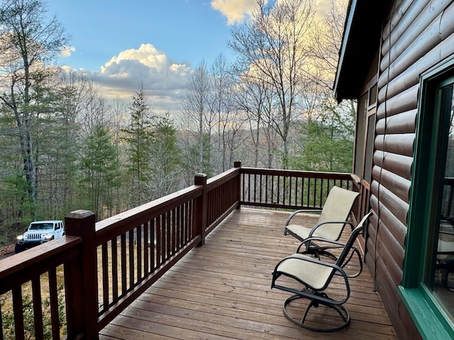 deck featuring a view of trees