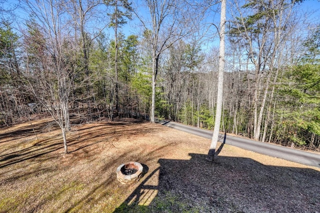 view of yard with a view of trees