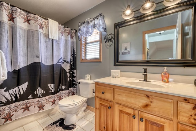 full bath with vanity, toilet, and tile patterned floors